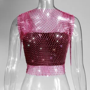 Detailed macro view of pink mesh top decorated with sparkling rhinestones on mannequin