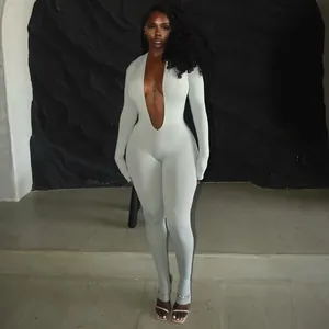 Detailed view of a sexy deep V neck long sleeve bodycon jumpsuit in solid light grey color