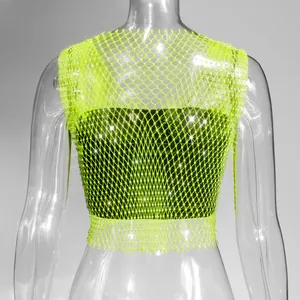 Close-up view of a neon green mesh tank top featuring shimmering rhinestone accents