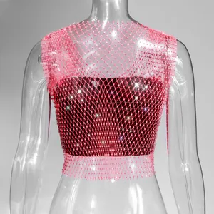Close-up detail of a sparkling pink rhinestone mesh tank top for sexy nightclub wear