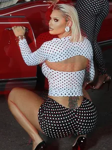 Sexy three-piece set featuring contrasting polka dot prints with shrug and high-waist shorts.