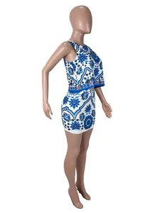 Detail showing side profile of a blue and white patterned sleeveless top and mini skirt