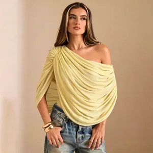 Detailed close-up view of the yellow one-shoulder pleated bodysuit for women