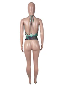 Rear view showing the backless design of a sexy halter neck mesh top on a mannequin