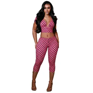 Detail view of pink polka dot 3-piece set featuring halter top and cropped leggings