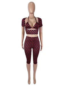 Detail view of 3-piece sexy polka dot outfit with shrug, top and capris