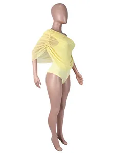 Detailed side view showing the draped ruched sleeve of this yellow one-shoulder bodysuit
