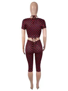 Rear view of women's sexy red polka dot print 3-piece set featuring crop top and leggings