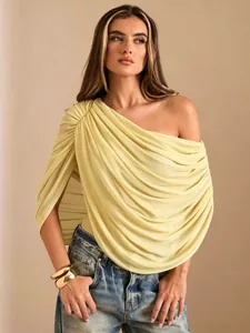 Elegant one-shoulder pleated bodysuit in pale yellow featuring sophisticated draped styling