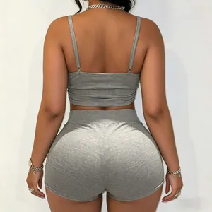 Back view of gray two-piece set featuring adjustable camisole and tight shorts