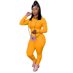 Conjunto de chándal naranja para mujer con manga larga y bolsillos con cremallera
