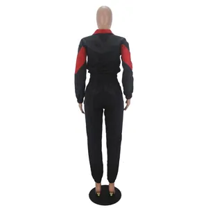 Detailed back view of the women's two-piece black and red windbreaker track suit set