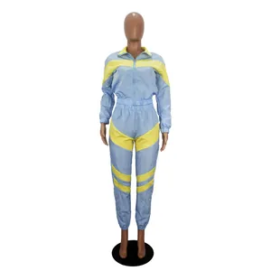 Two-piece color block windbreaker tracksuit set in light blue and yellow for women's activewear