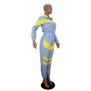 Two-piece light blue and yellow color block windbreaker tracksuit for women