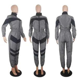 Detailed three-sided view of gray and black color-blocked long-sleeved windbreaker jumpsuit