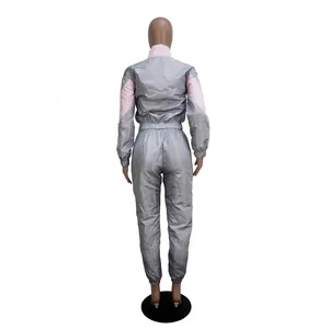 Back view of a grey and pink two-tone long-sleeve windbreaker tracksuit