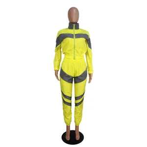 Full body display of a yellow and grey reflective windbreaker tracksuit on mannequin