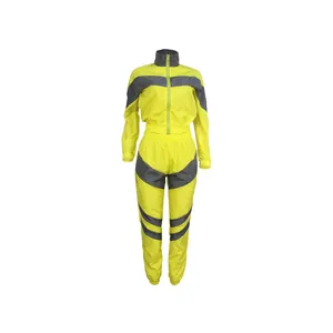 Front view of neon yellow and grey two-piece windbreaker tracksuit set for women
