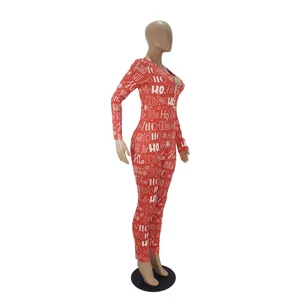 Side view detail of festive red Christmas jumpsuit featuring white HO HO HO holiday print