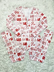 Festive white long-sleeved Christmas jumpsuit pajamas featuring red HO HO HO pattern design