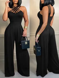 Detaillierte Vorder- und Rückansicht eines schwarzen Jumpsuits mit Kreuzträgern