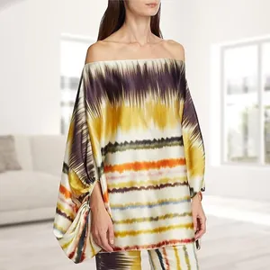 Detail view of satin printed off-the-shoulder top and matching pants in abstract stripes