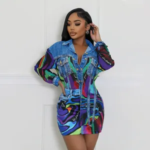 Detail view of denim print bodycon dress with vibrant abstract graffiti patterns.