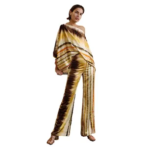 Elegant satin printed two-piece set featuring a one-shoulder top and wide-leg trousers