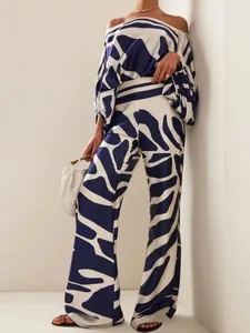 Elegant women's satin two-piece set featuring navy abstract print and wide-leg pants