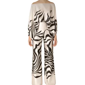 Elegant satin two-piece set with wavy abstract print and wide-leg trousers