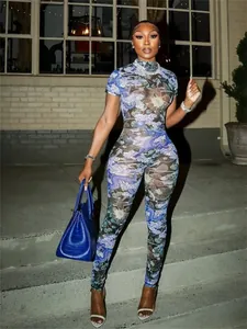 Sexy blue dragon pattern print sheer mesh jumpsuit for women worn outdoors at night