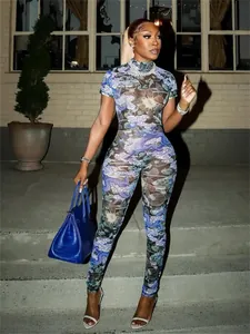 Full view of a sexy mesh jumpsuit featuring a blue dragon print and sheer fabric design.