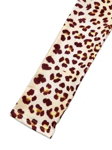Close-up detail of leopard print pattern fabric with high-quality seam stitching