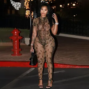 Sexy brown snakeskin print sheer mesh jumpsuit with high neck worn by model at night