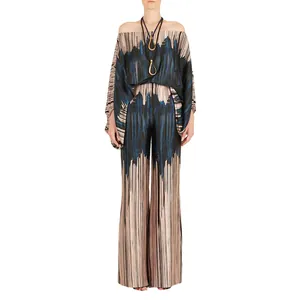 Full view of women's satin printed two-piece set with off-the-shoulder top and wide pants