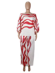 Detailed view of women's satin two-piece set with red wavy print and boat neck.