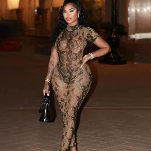 Detailed outdoor night shot of a sexy brown snakeskin print mesh jumpsuit for women
