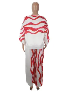 Back view of a women's satin two-piece set featuring red wavy prints on white fabric
