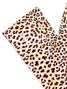 Detailed close-up showing the high-quality leopard print fabric texture of the casual pants