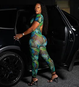 Sexy backless jumpsuit featuring a vibrant tropical leaf print in sheer mesh fabric.