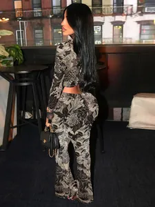 Back view of a stylish two-piece set featuring a detailed gray and black print