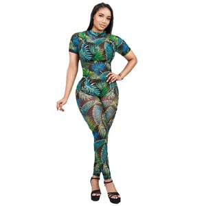Full view of sexy tropical palm leaf print mesh see-through jumpsuit for women