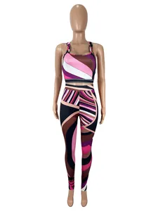 Full view of women's two-piece set with vibrant geometric colorblock print on mannequin