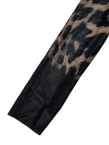 Close-up detail of the semi-transparent black mesh fabric with leopard print pattern.