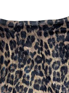 Close-up detail view of the stylish leopard print fabric with high waist stitching.