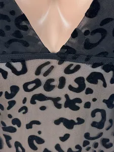 Close-up of sexy black mesh bodysuit with velvet leopard print pattern details