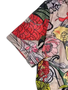 Detail of sexy mesh jumpsuit featuring colorful koi fish and floral pattern print
