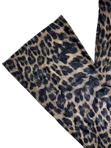 Close-up of trendy leopard print pattern on lightweight high-waist two-piece set fabric.