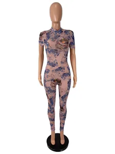 Full view of a sexy mesh jumpsuit featuring traditional dragon and hannya mask prints