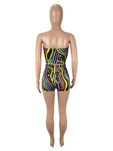 Back view of a vibrant colorful graffiti print two-piece set with tube top and shorts.